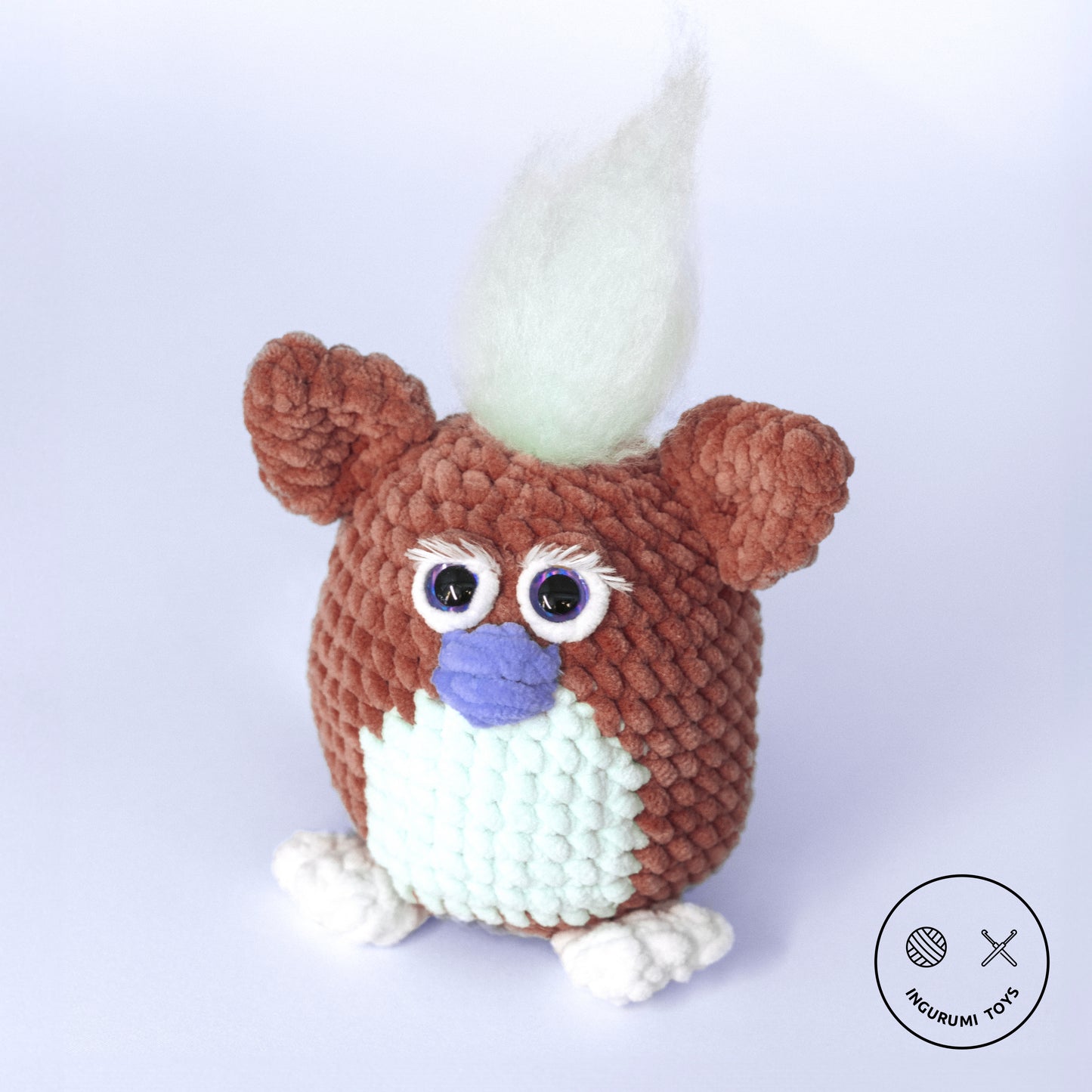 Crochet amigurumi pattern for Furby the 90s toy made with brown plushie yarn