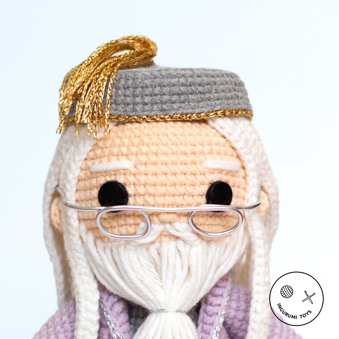 Amigurumi crochet pattern – Dumbledore toy with a lilac cloak and iconic half-moon shaped glasses