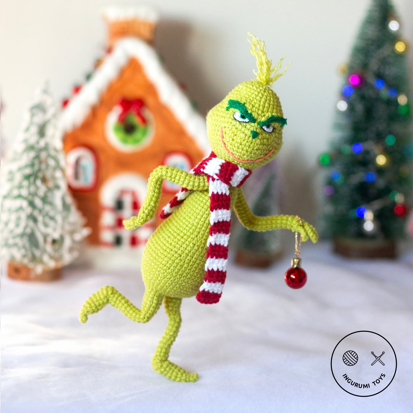 Grinch amigurumi crochet toy pattern with red and white scarf