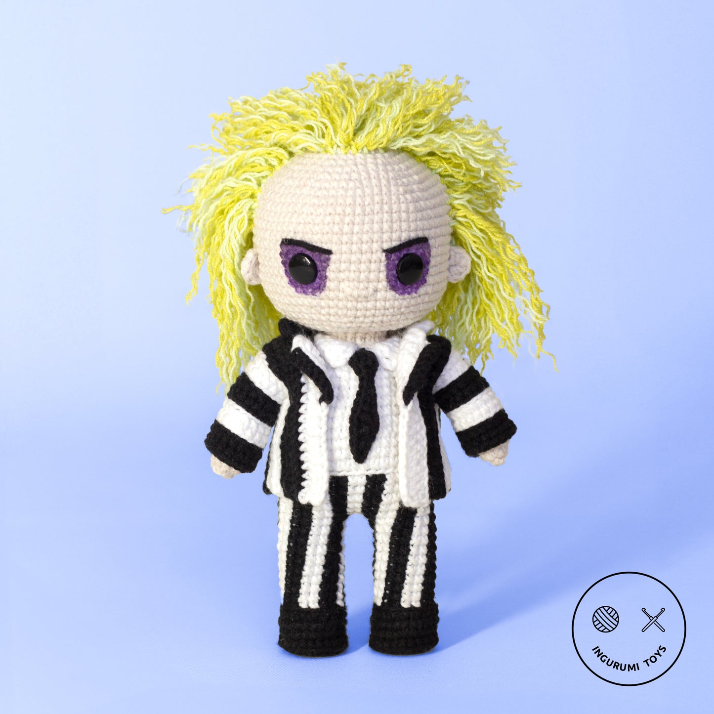 Amigurumi crochet toy of Beetlejuice with green hair and a black-and-white striped suit, PDF pattern