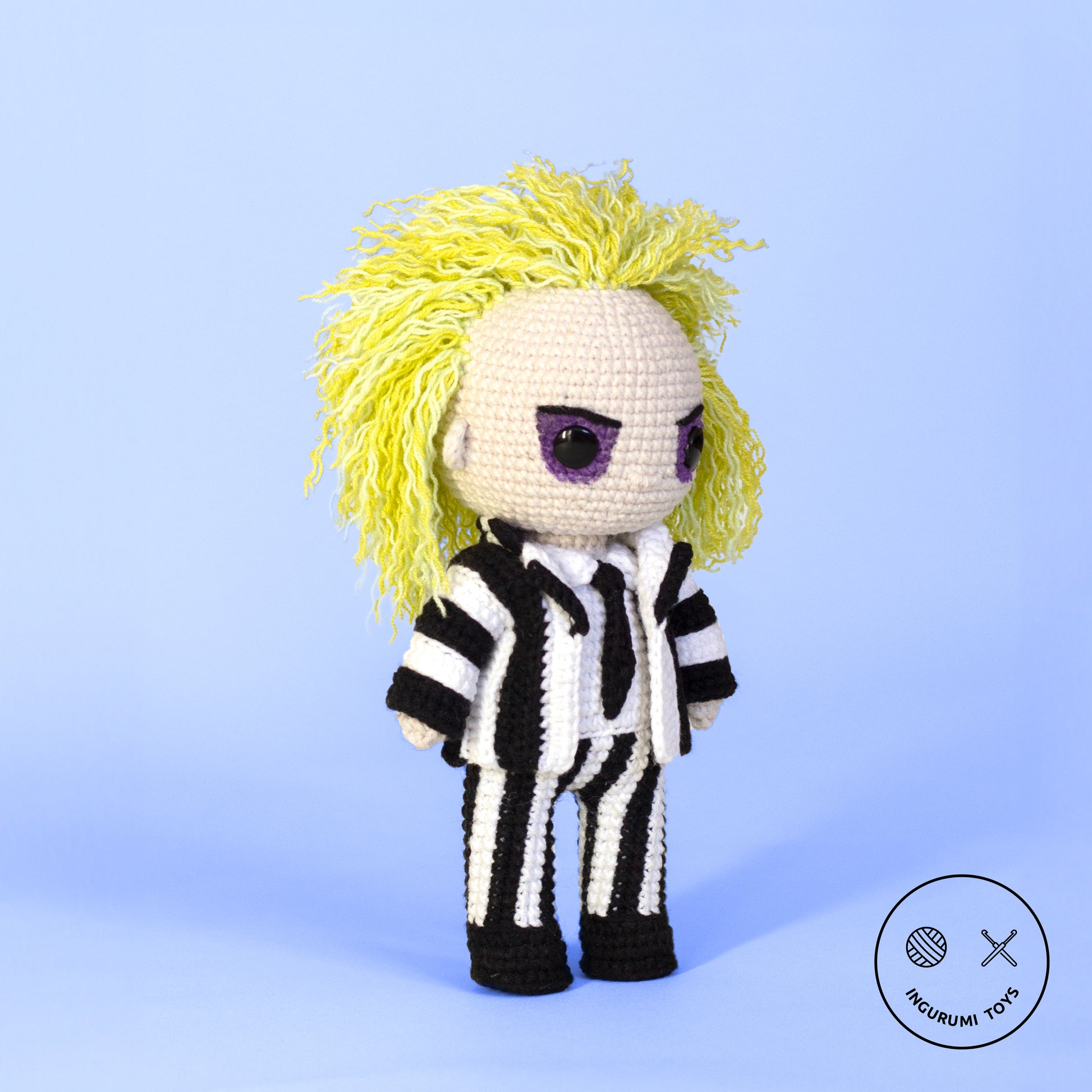 Crochet pattern for crocheting a Beetlejuice amigurumi toy in black-and-white striped suit