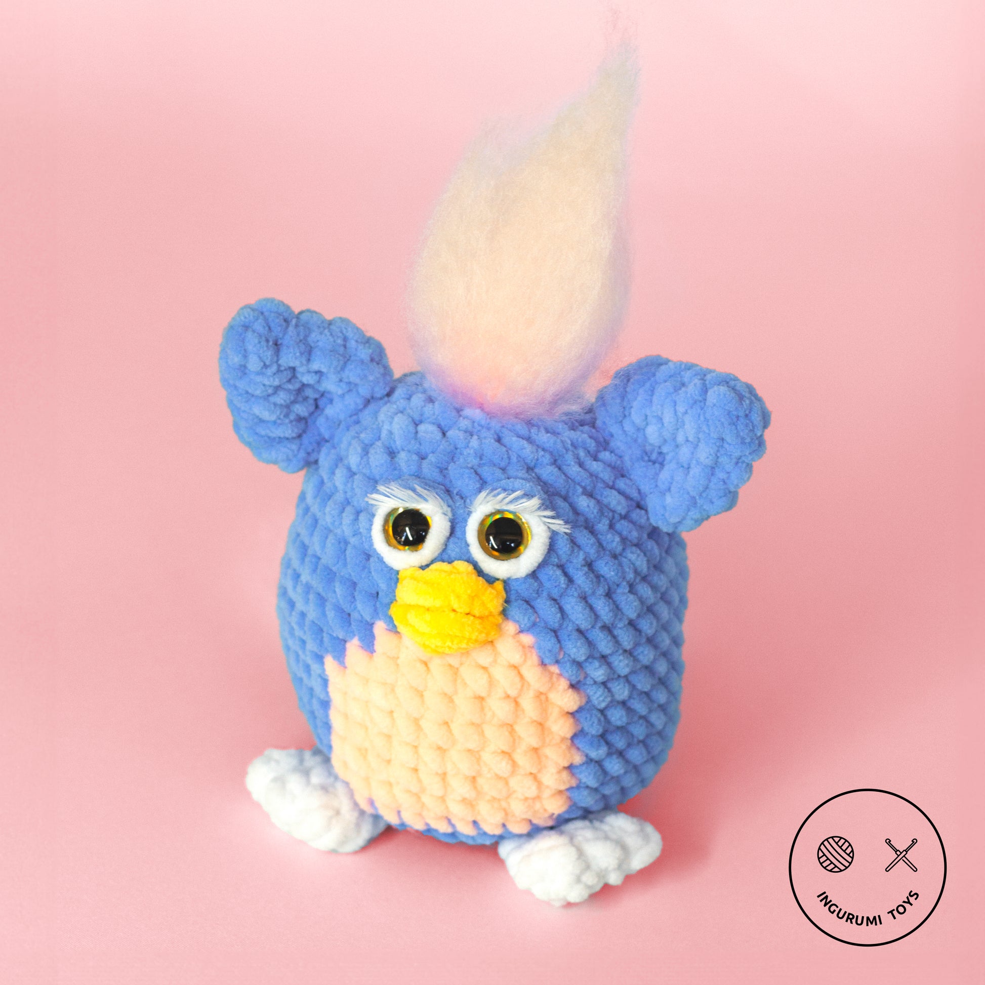 Crochet amigurumi pattern for Furby the 90s toy made with blue plushie yarn