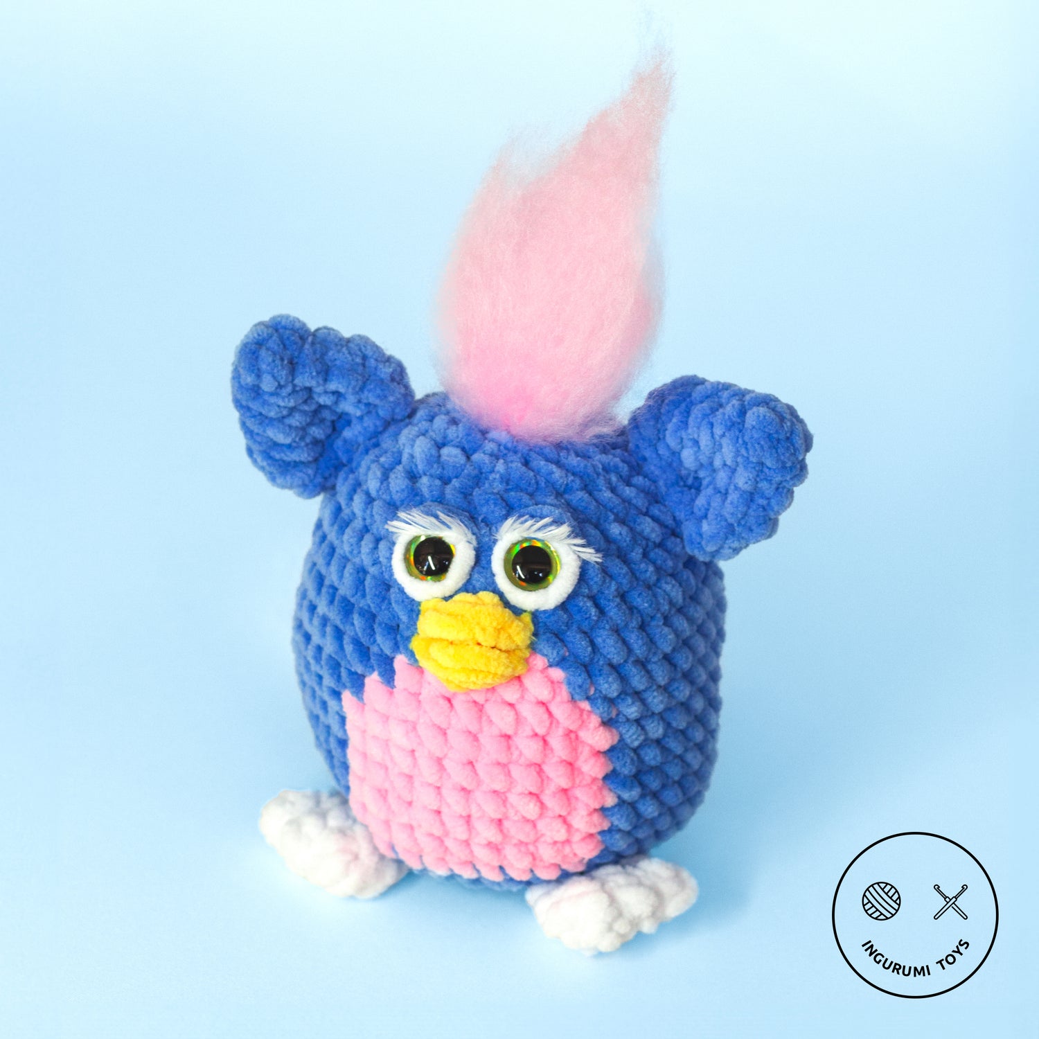 Crochet amigurumi pattern for Furby the 90s toy made with blue and pink plushie yarn