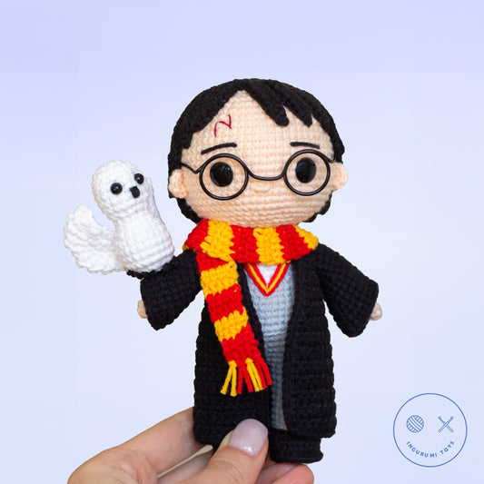 Harry Potter amigurumi crochet pattern – toy in black cloak with red and yellow Gryffindor scarf and crocheted Hedwig owl